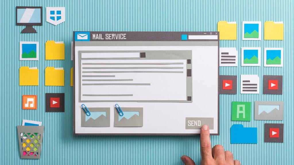 Cardboard cutout image depicting an email about to be sent