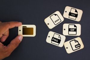 Wooden icons of different file types such as JPEG and PNG.