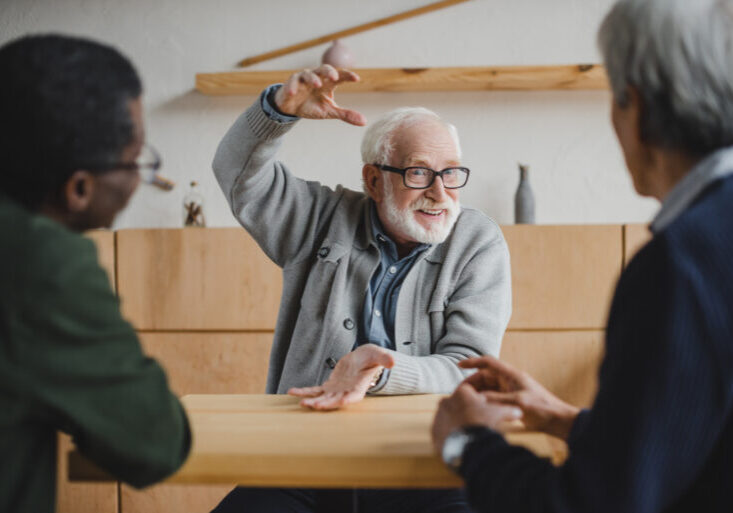 An elderly man sharing the story of his business brand.